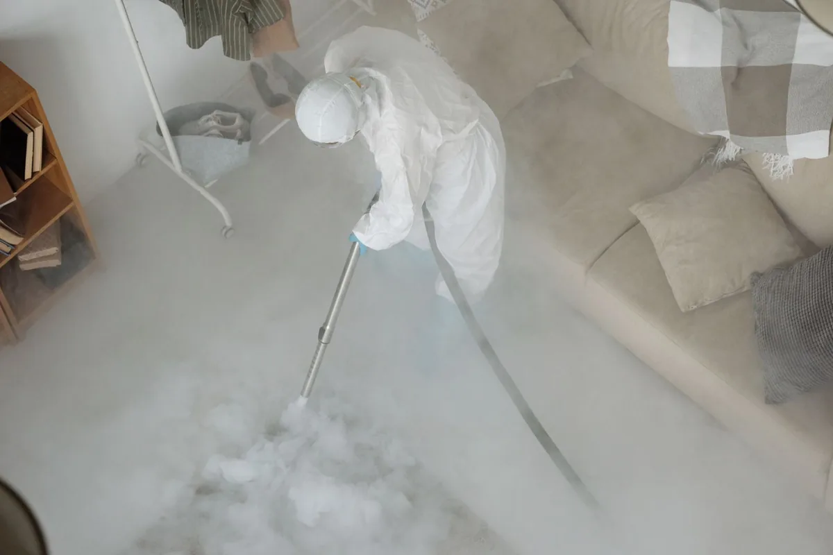Biohazard cleanup technician in protective equipment, Brighton, Boston, MA